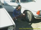 sweet girl peeing between the cars